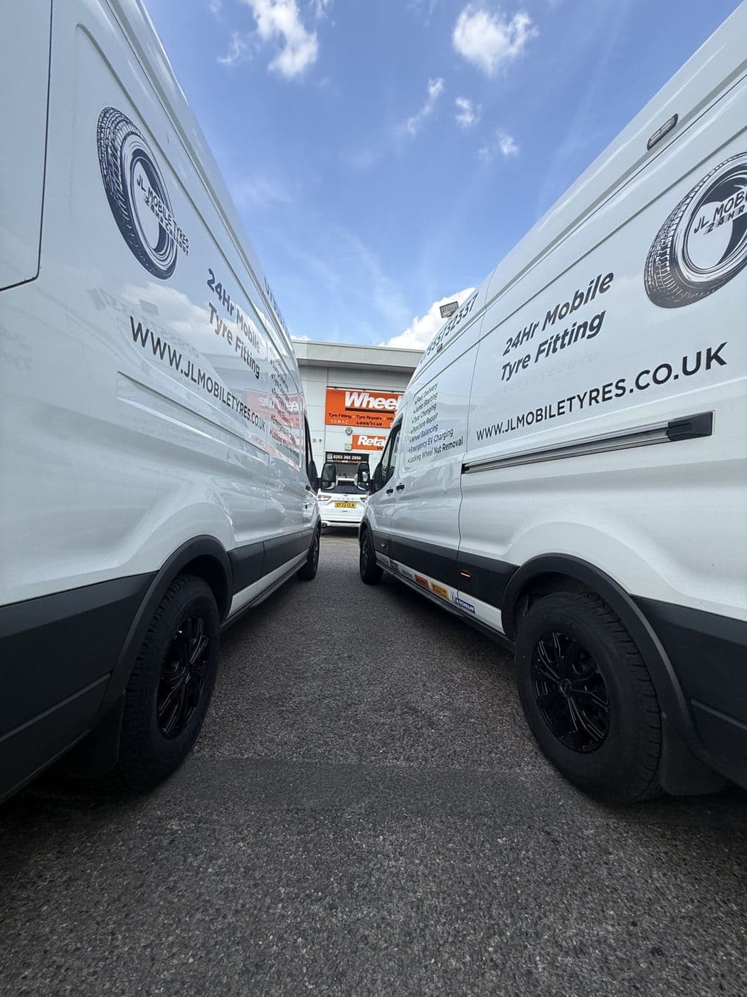 Two JL Mobile Tyres vans parked side by side