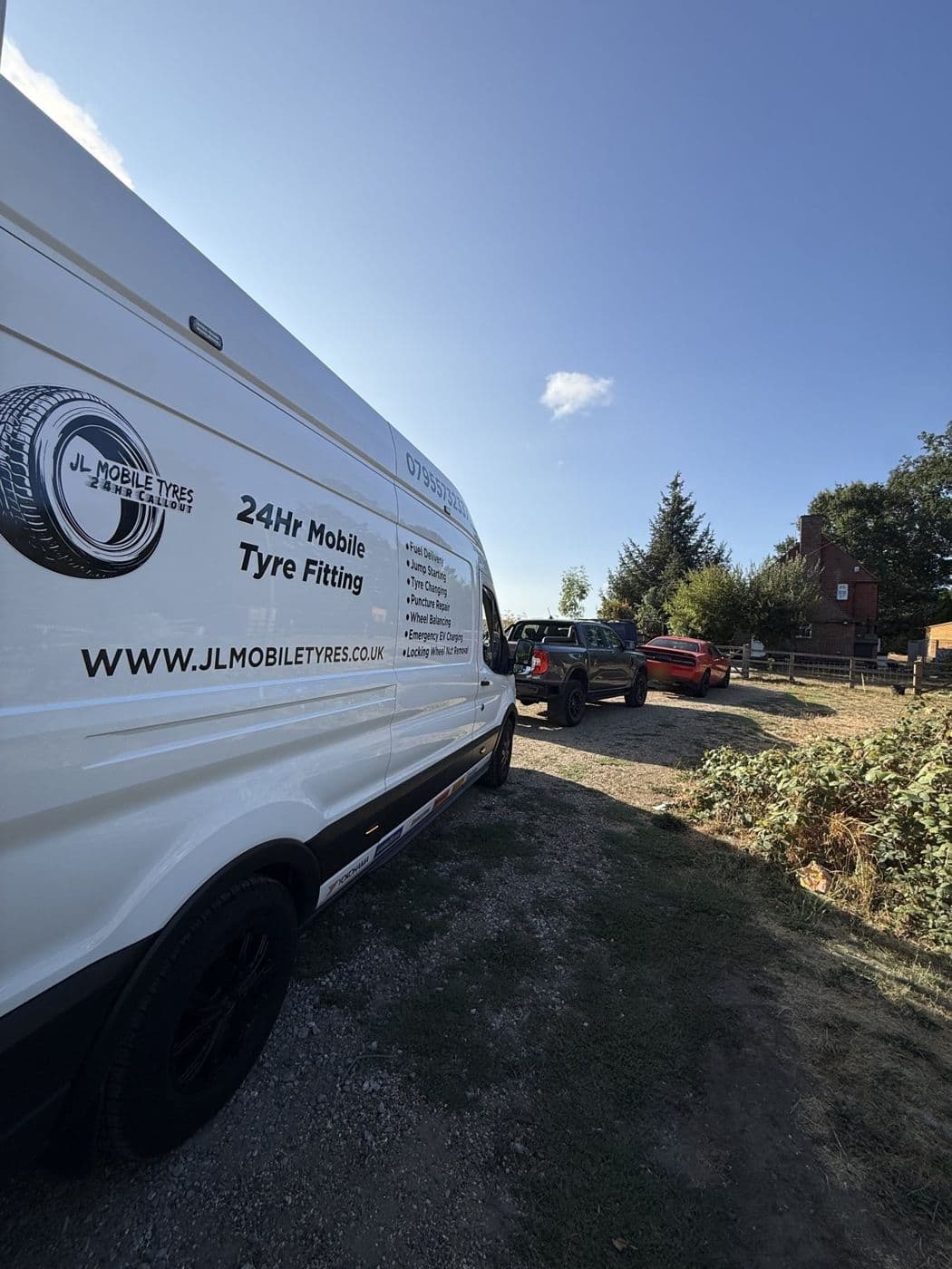 Side of a JL Mobile Tyres van reading 24Hr Mobile Tyre Fitting and the web address